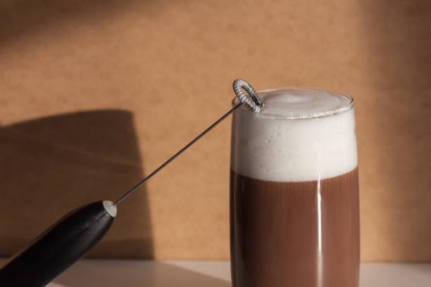 Milk frother and coffee